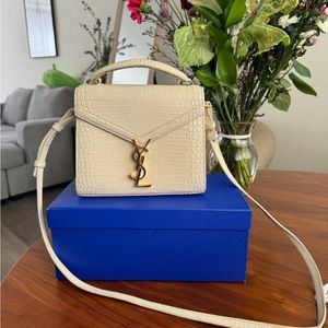 SAINT LAURENT
Mini Classic Monogram Cassandra Top Handle Crema Soft